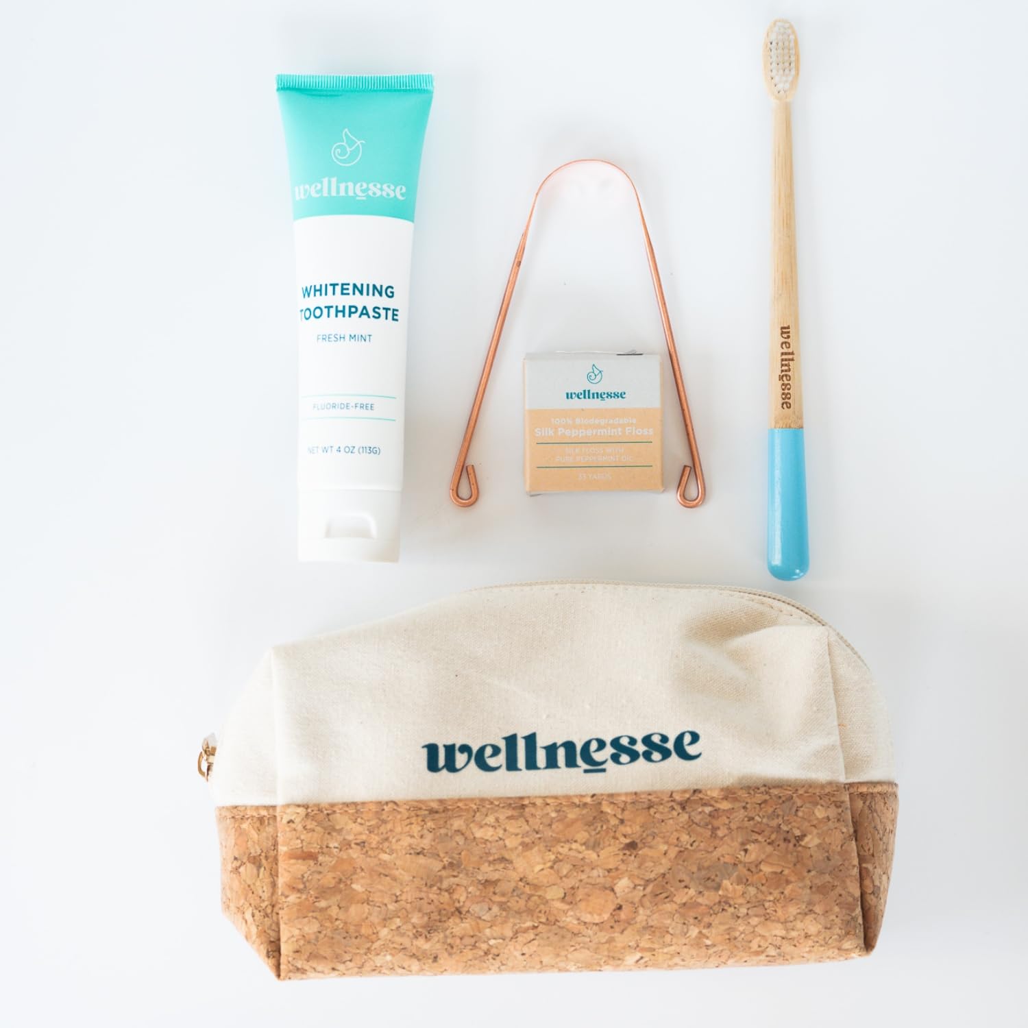 Wellnesse Essential Travel Oral Care Set - Compact Travel Dental Kit w 4 oz Whitening Hydroxyapatite Toothpaste, Adult Toothbrush, Copper Tongue Scraper, Silk Floss & Eco-Friendly Pouch, Mint Flavor